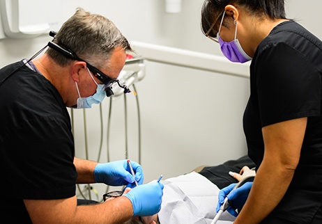 Geneva dentist and dental team member treating a dental patient