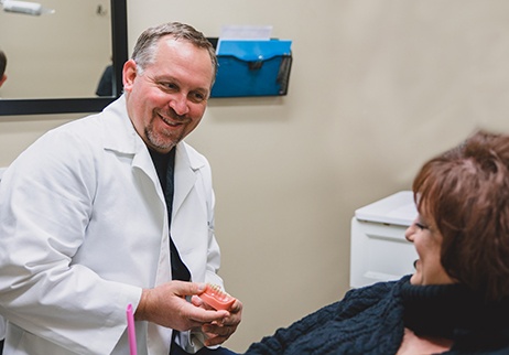 Doctor Owens laughing with dental patient