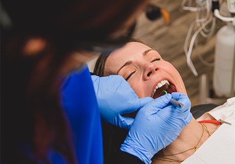 Dental patient receiving emergency dentistry treatment