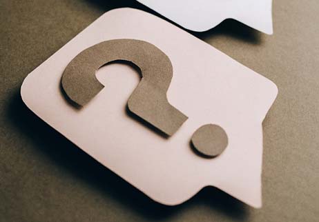Question marks on paper cutouts