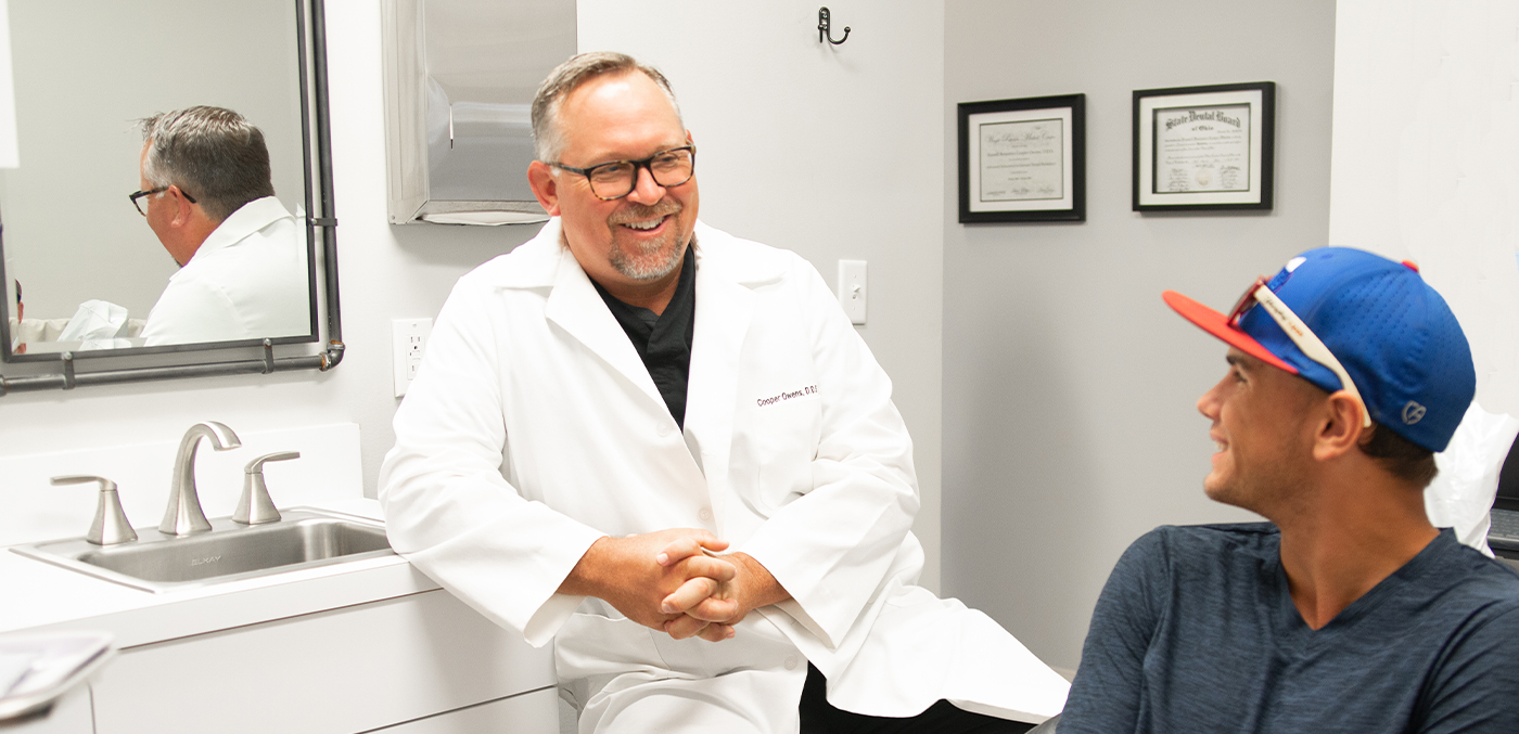 Geneva dentist laughing with dental patient