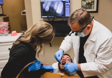 Doctor Owens and team member providing dental crown restoration