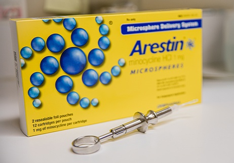 Arestin antibiotic therapy for gum disease treatment