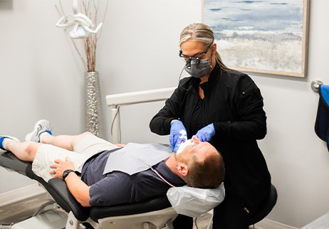 Man receiving oral cancer screening