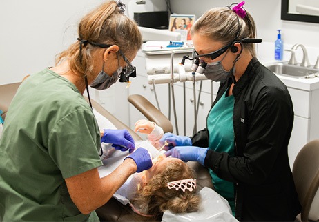 Two young kids smiling at dental office for children's dentistry