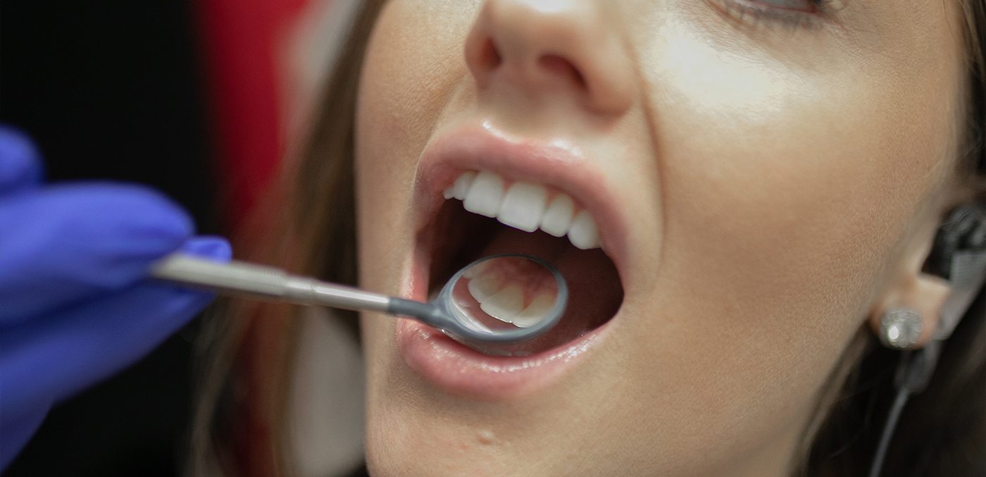 Woman receiving preventive dentistry exam