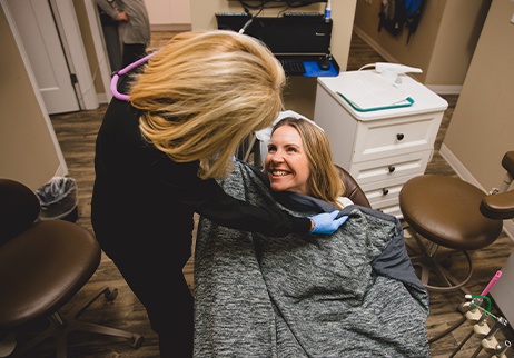 Patient under oral conscious dental sedation being prepped for treatment