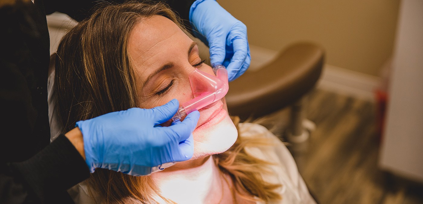 Woman with nitrous oxide nose mask in place