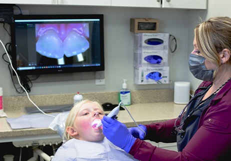 Dental team member capturing intraoral images