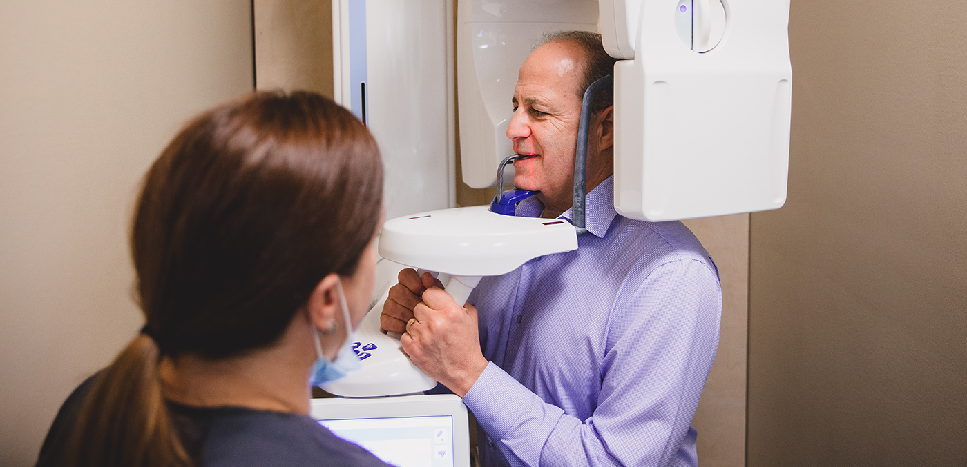 Man receiving 3 D C T digital x-ray scan