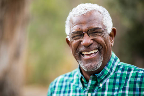 person smiling after transitioning to dental implants